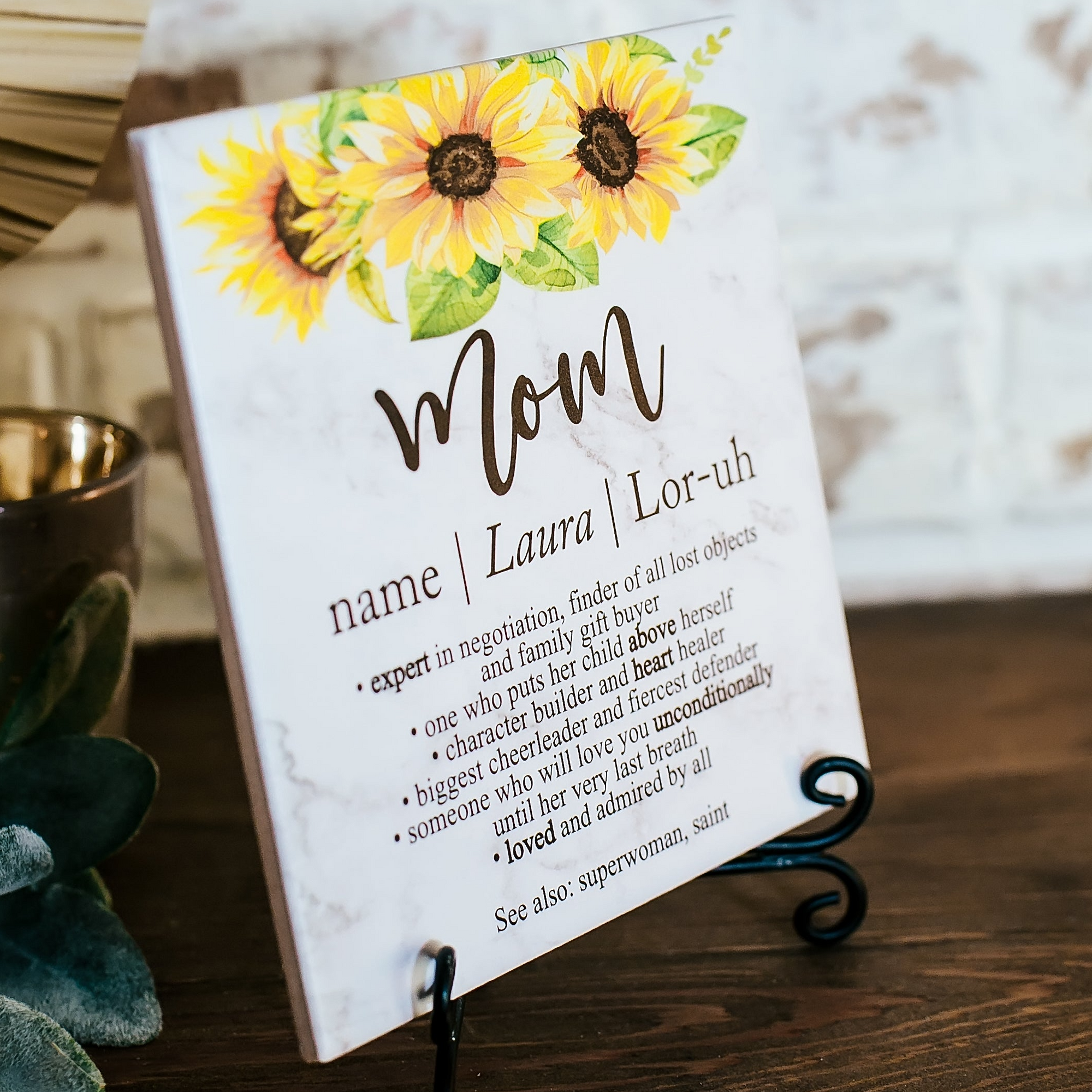 a mother's day sign with sunflowers on it
