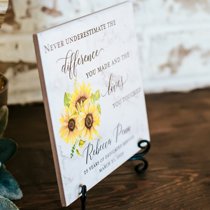 a card with sunflowers on it sitting on a table