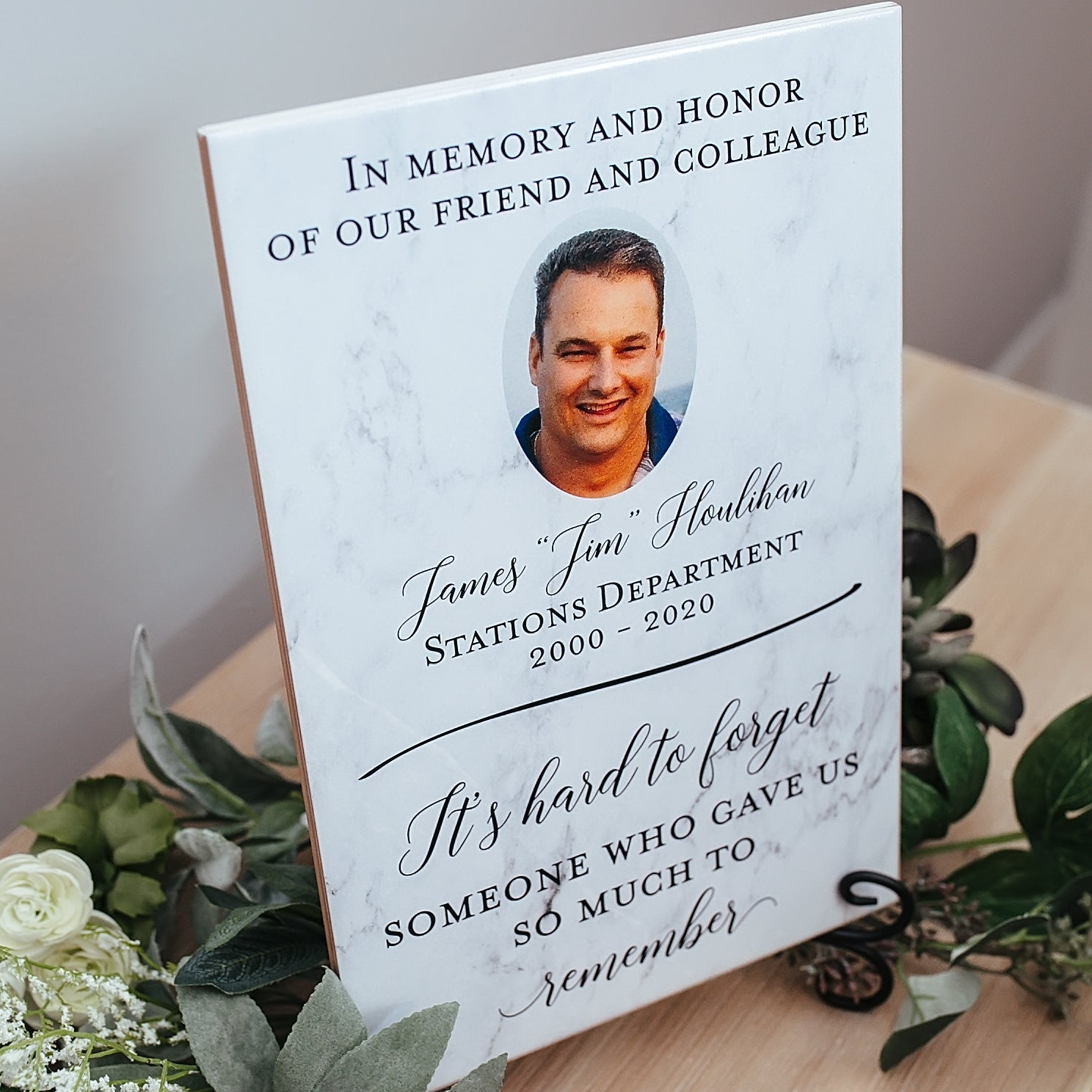 a memorial book with a picture of a man