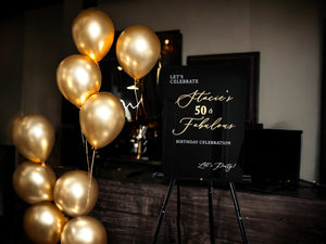 50th birthday welcome sign with gold and black