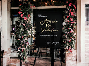 50th birthday welcome sign with gold and black